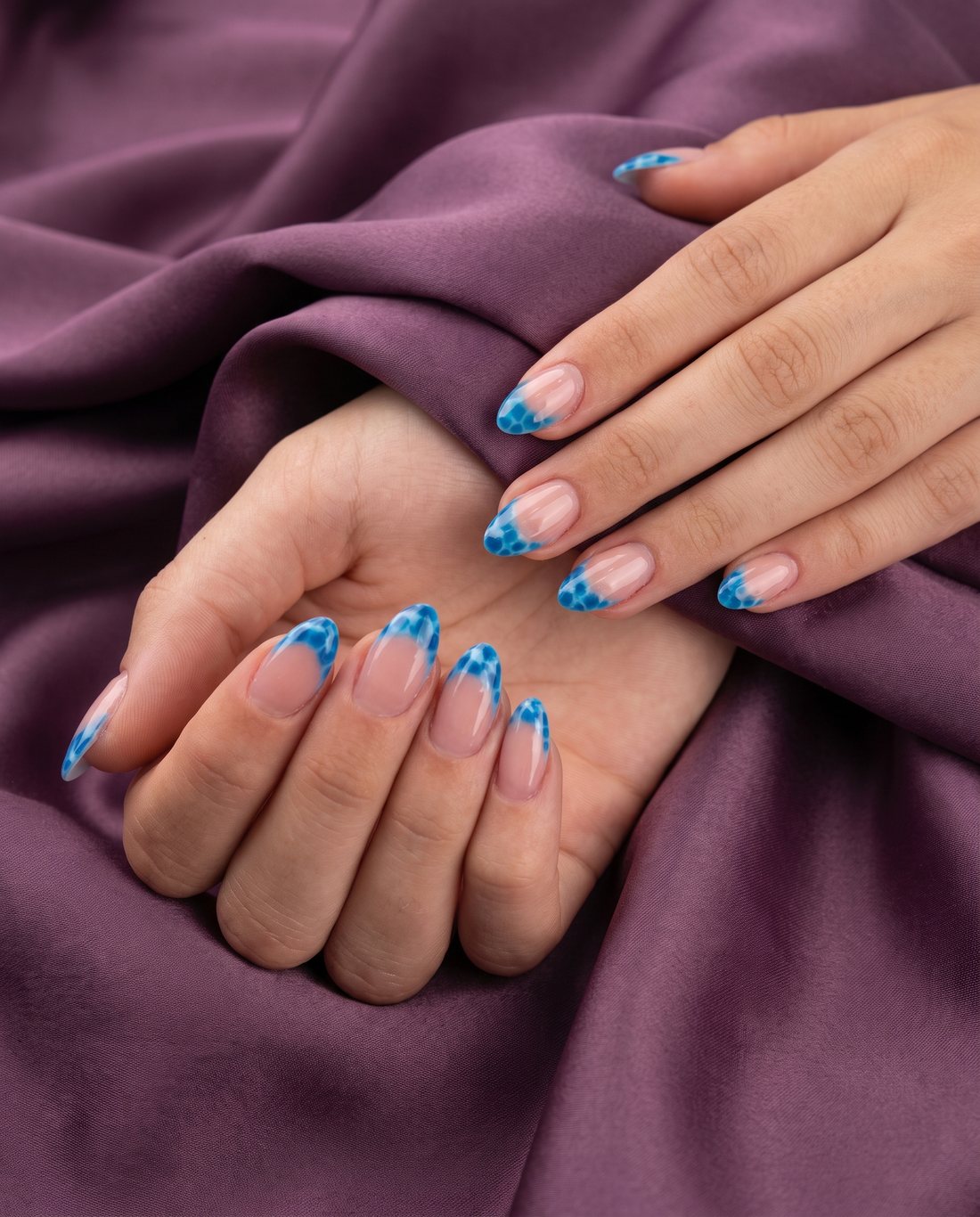 Blue marbled water-pattern French tips